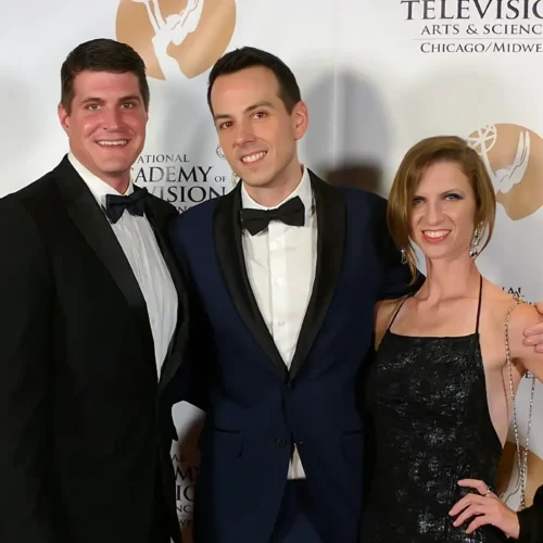 The See It Media team in formal attire smile for a group photo at an awards ceremony.