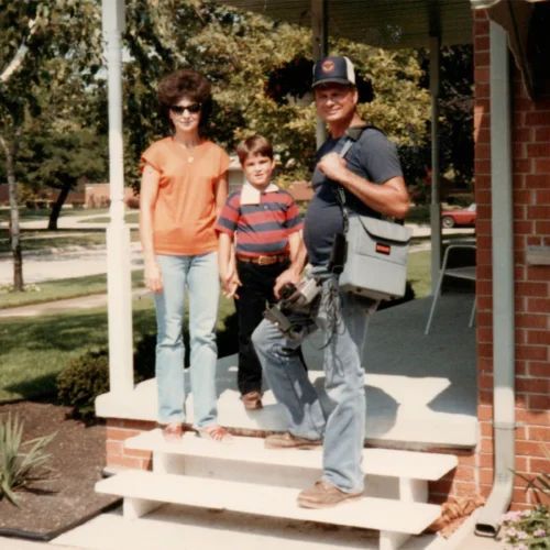 See It Media Beginnings - a young Matthew with his parents, his father caring a VHS camcorder