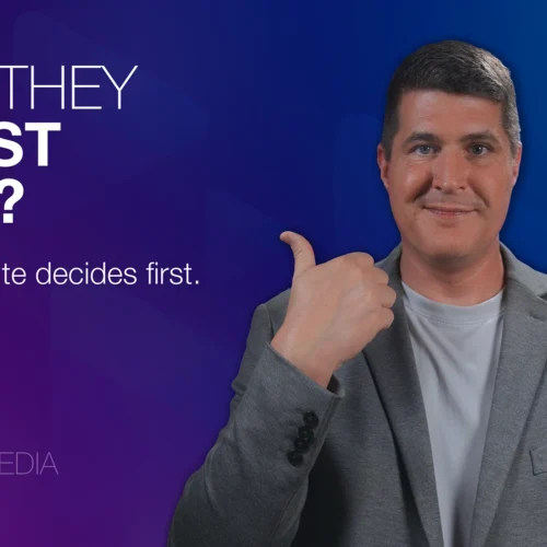 Image for the blog post: The Trust Gap: Why Website Trust Signals Matter Most. Features a man in a gray blazer giving a thumbs‑up beside bold text that reads: Can they trust you.